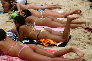 girls in bikinis on beach in Brazil